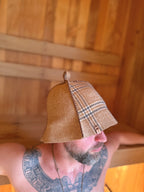 side view person wearing a beige plaid sauna hat nz wool