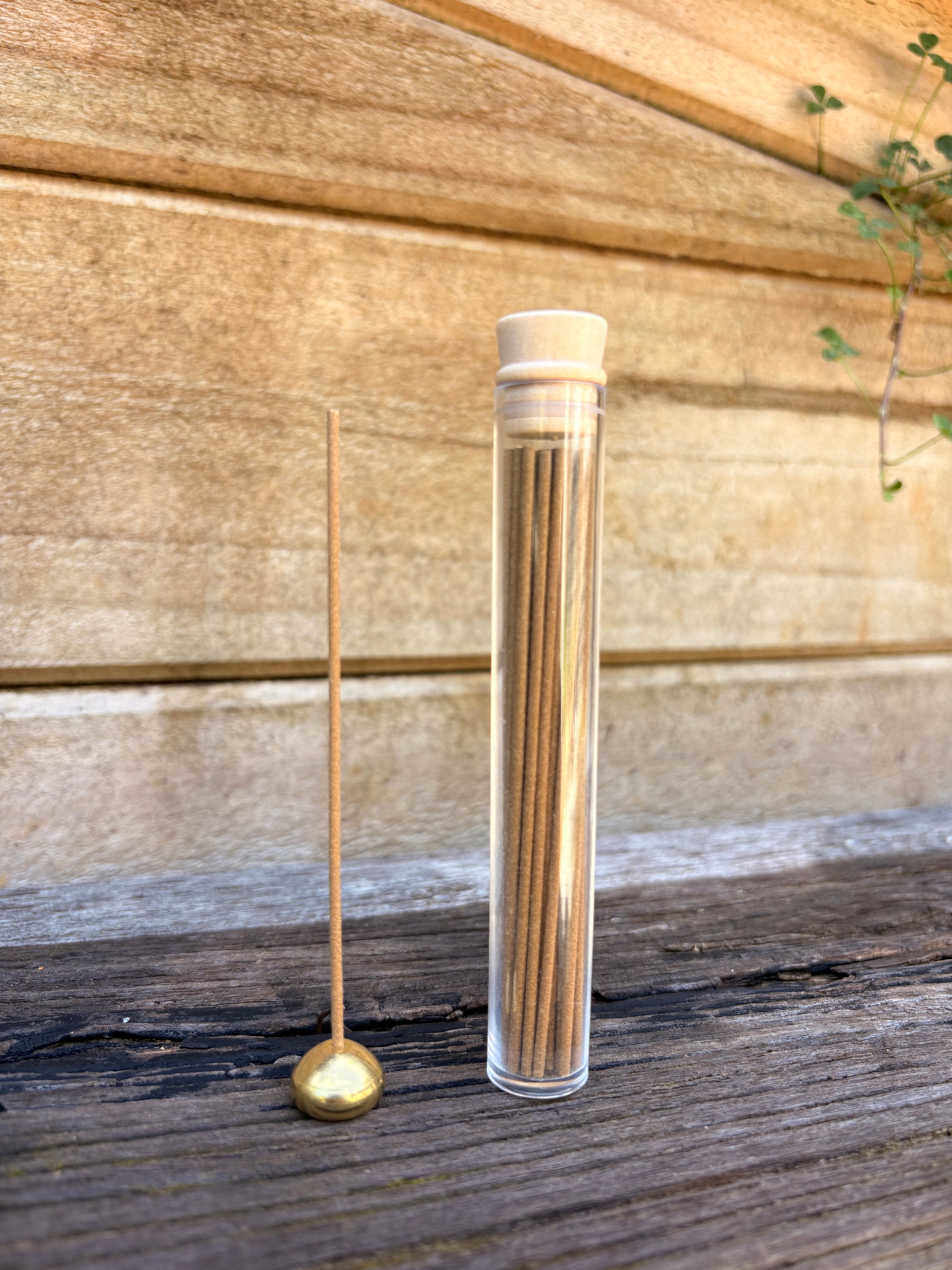 white sage Incense sticks on a wooden surface
