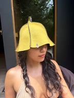 person wearing yellow wool sauna hat nz wool in sauna