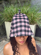 Woman wearing pink checkred wool sauna outdoor