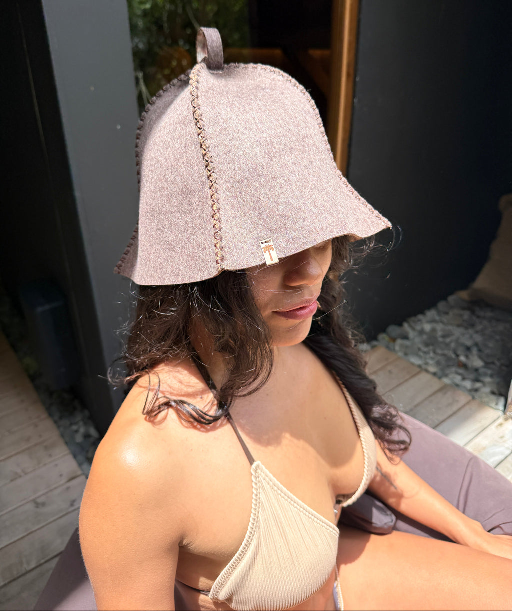 woman wearing a sauna hat nz wool in the sauna