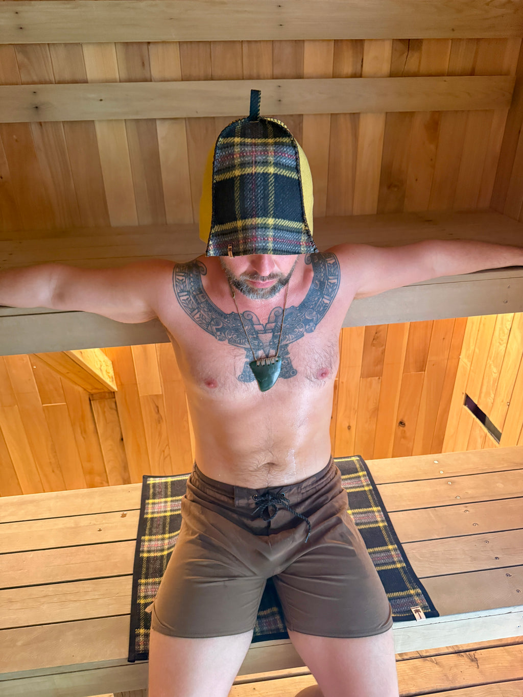 person wearing a sauna cap in the sauna