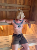 man using sauna mat NZ wool inside sauna