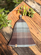 sauna hat nz wool plaid design on wooden surface with natural setting