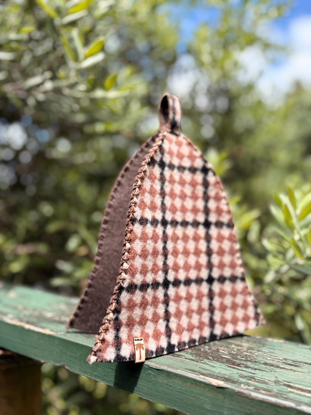 earth rust check wool sauna hat front view outdoor